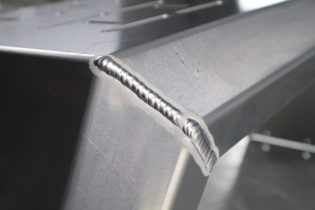 Close-up of a metal structure with a weld joint