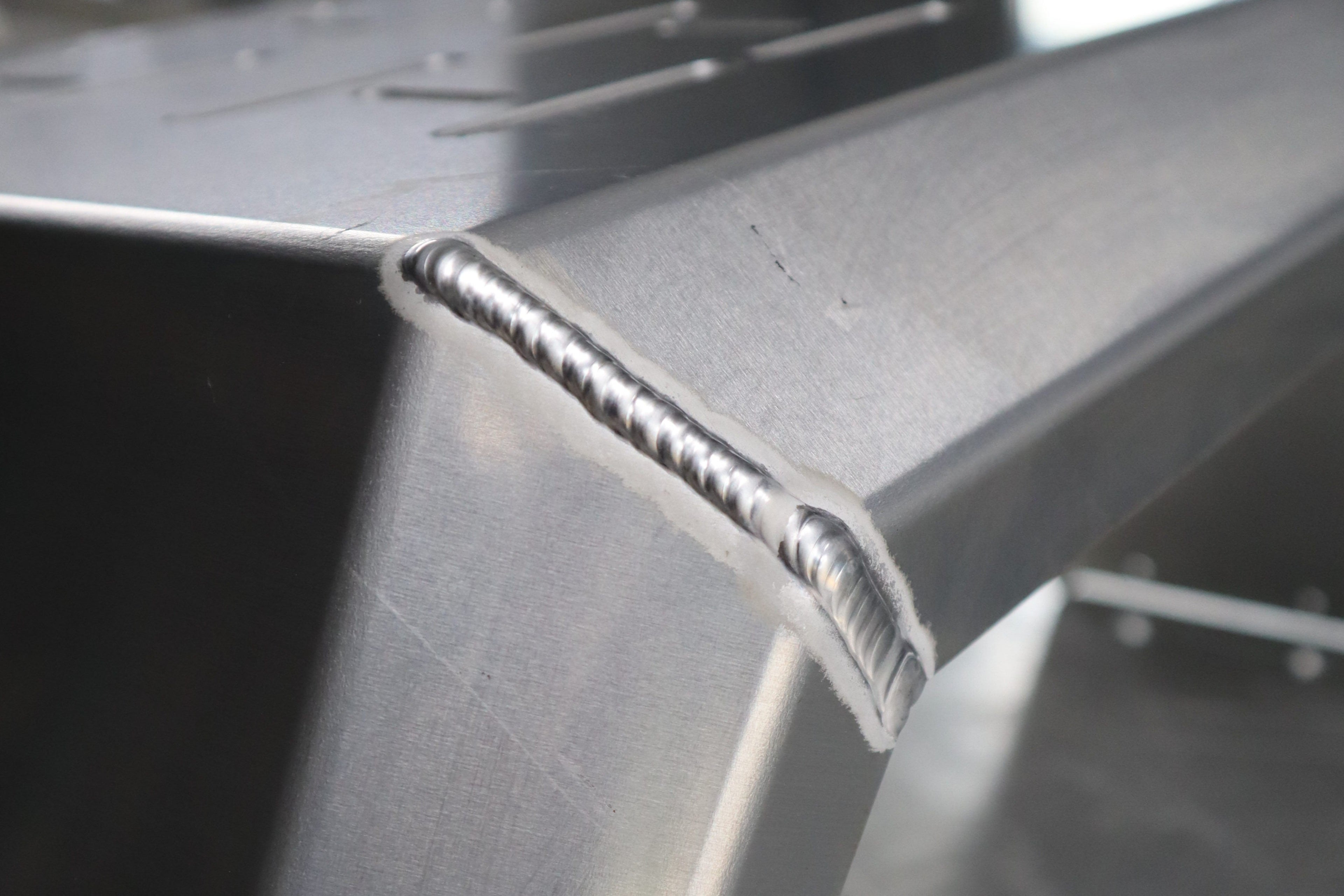 Close-up of a metal structure with a weld joint